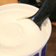 A freshly opened tub of whipped topping